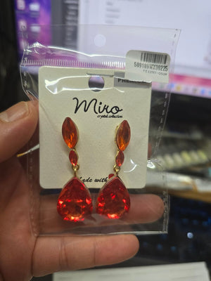 Small Double Orange Crystal Teardrop Earrings on Gold shown in a model's hand