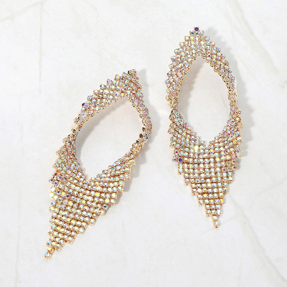 AB abstract layered crystal statement earrings on gold displayed on a white background.