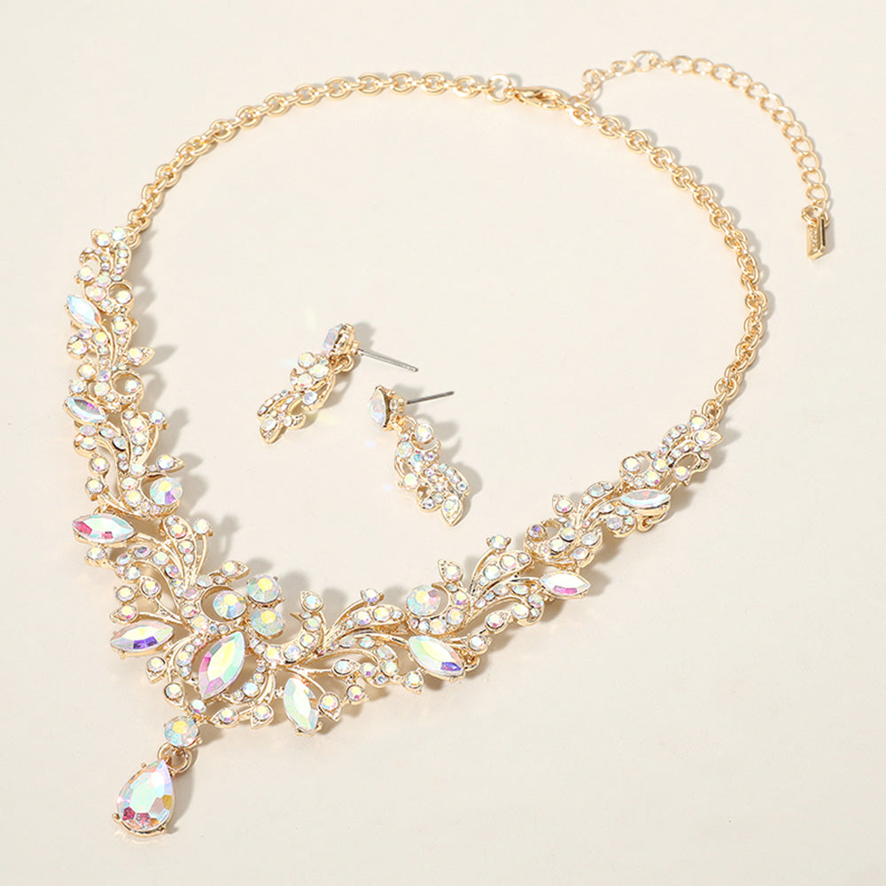 AB crystal stone cluster prom necklace set on gold with matching earrings on a cream background
