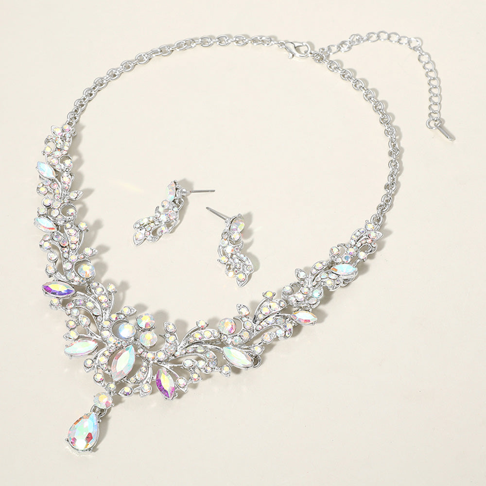 AB crystal stone cluster prom necklace set on silver with matching earrings on a cream background