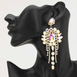 Long 4.6" AB on gold chandelier fringe earrings on a black mannequin ear — dramatic crystal statement jewelry for pageant, prom, weddings, and evening events.
