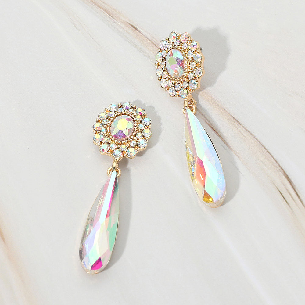 AB crystal halo long teardrop dangle earrings on gold on a white marble background