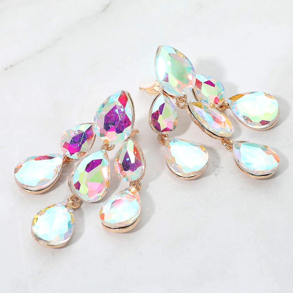 AB crystal teardrop cluster chandelier clip-on earrings on gold with iridescent stones on white marble background
