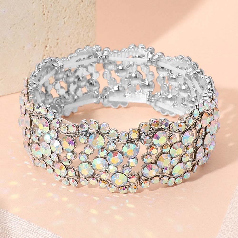 A wide, multi-strand stretch bracelet embellished with AB rhinestones and silver-tone metal, displayed on a soft light background.