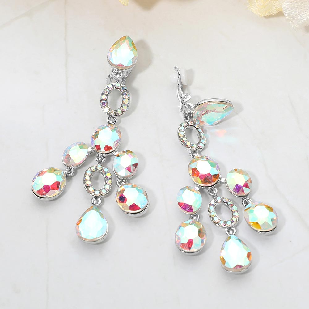 AB faceted chandelier clip-on earrings with cascading dangle stones and silver-tone setting on a marble background