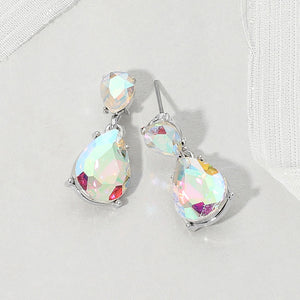 Double teardrop dangle earrings with iridescent Aurora Borealis crystals on silver, measuring 1 inch long by 0.4 inch wide, featuring smaller faceted teardrops above larger drops, displayed on a white textured surface.