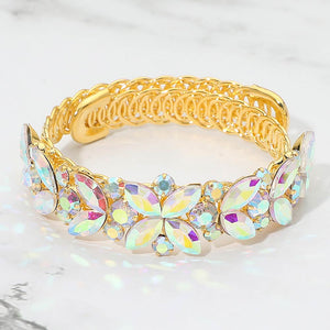 AB marquise floral crystal bracelet on gold with adjustable fit, iridescent statement jewelry for prom and evening wear on a marble background