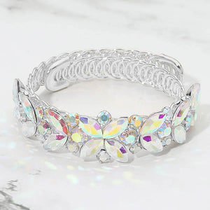 AB marquise floral crystal bracelet on silver with adjustable fit, iridescent statement jewelry for prom and evening wear on a marble background
