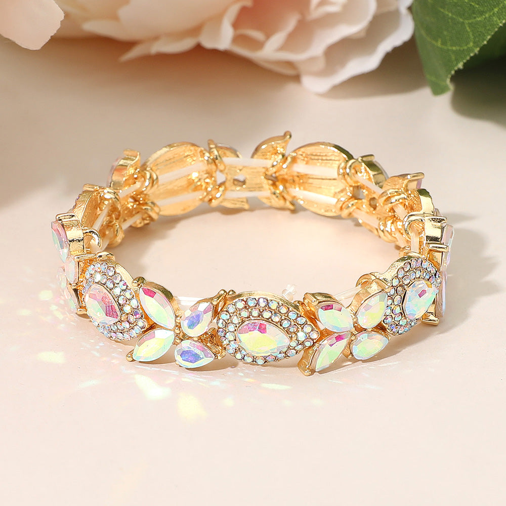 AB marquise rhinestone bracelet on gold stretch band for pageants or prom on a peach background