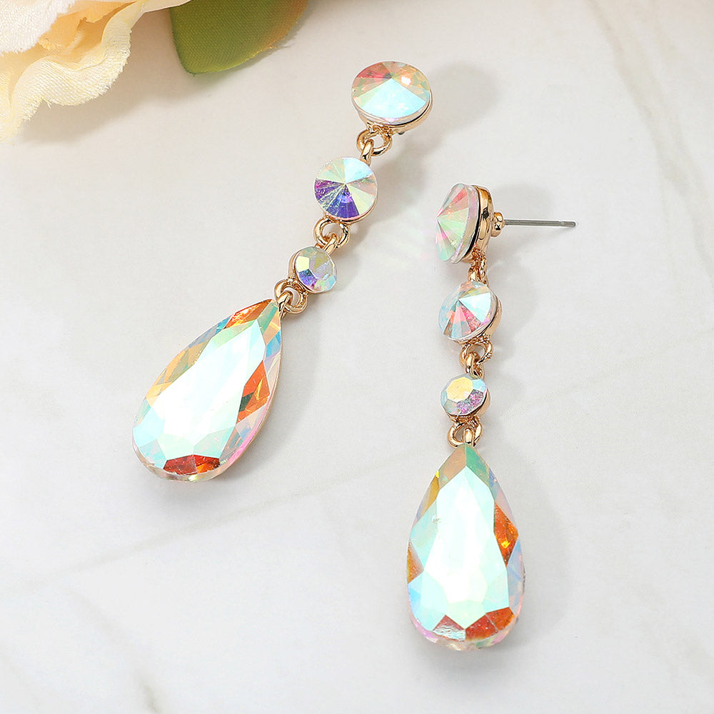 AB rhinestone multi stone dangle earrings on gold-tone setting with teardrop crystal on a white background