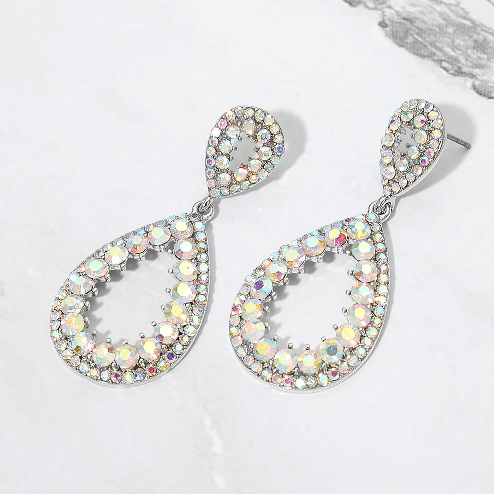 Aurora Borealis (AB) pave open teardrop earrings on silver displayed on white marble background