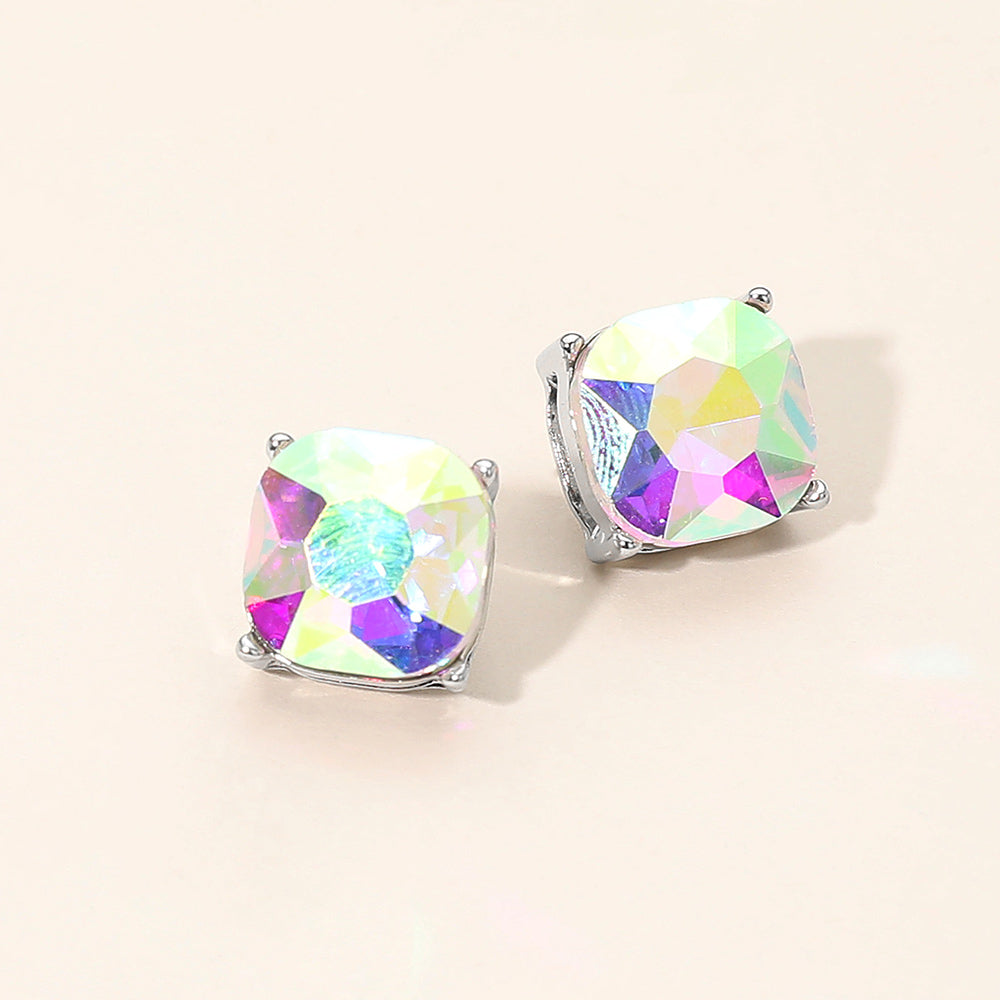 AB square cushion stud earrings on silver on light beige background