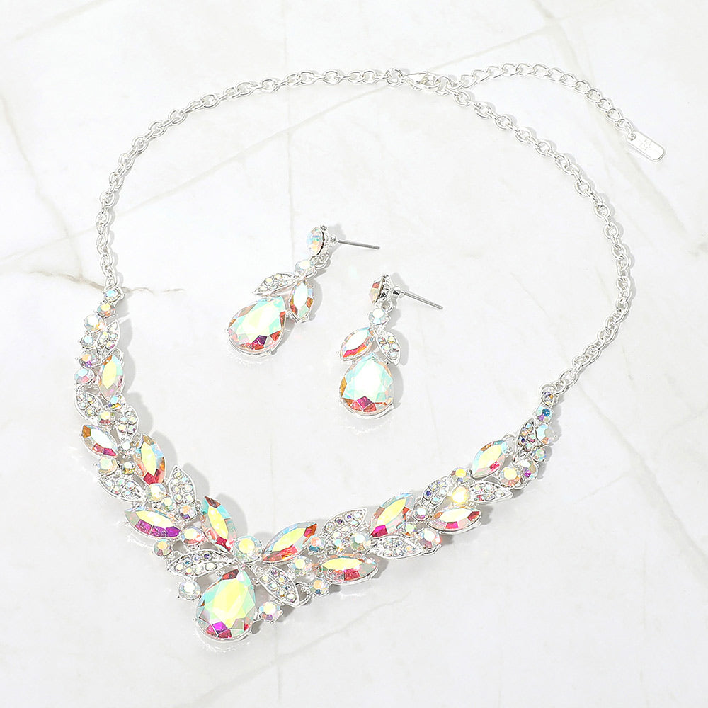 Aurora Borealis AB teardrop and marquise crystal jewelry set on silver displayed on white marble background
