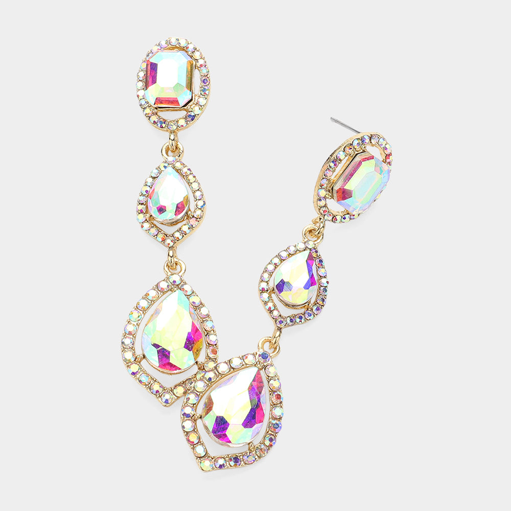 Pair of gold-tone drop earrings featuring large AB oval and pear-shaped crystals surrounded by small AB stones on a light gray background.