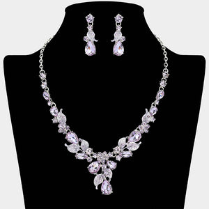 Purple Amethyst teardrop leaf necklace set on silver with matching earrings for prom and evening wear on a black mannequin bust on a white background.