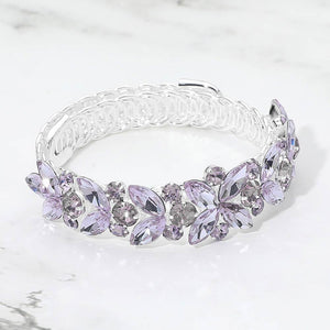Amethyst purple marquise floral crystal bracelet on silver with adjustable fit, elegant statement jewelry for prom and evening wear on a marble background