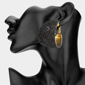 Black bling pavé crystal wide hoop earrings on gold-tone metal with dense faceted rhinestone coverage and omega backs, displayed on a black mannequin profile.