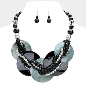 Black chunky round link statement necklace set with matching earrings on white bust