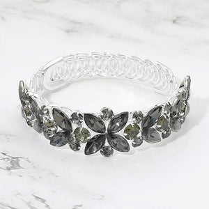 Smoky gray crystal floral bracelet on silver featuring marquise stones, refined pageant and formal jewelry on a marble background