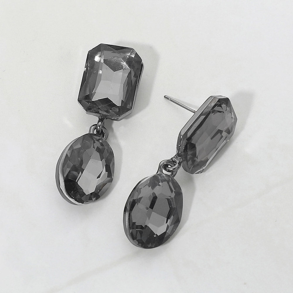 Gray Oval and Emerald Cut Stone Dangle Pageant Earrings  | Interview Drop Earrings on a gray background