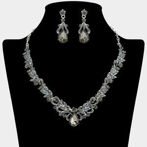 Black diamond - gray - teardrop leaf crystal statement necklace set with matching earrings in a silver setting, shown on a black mannequin bust on a white background