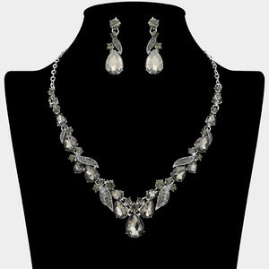 Smoky grey teardrop leaf prom necklace set on silver with matching earrings displayed on a black mannequin bust on a white background.