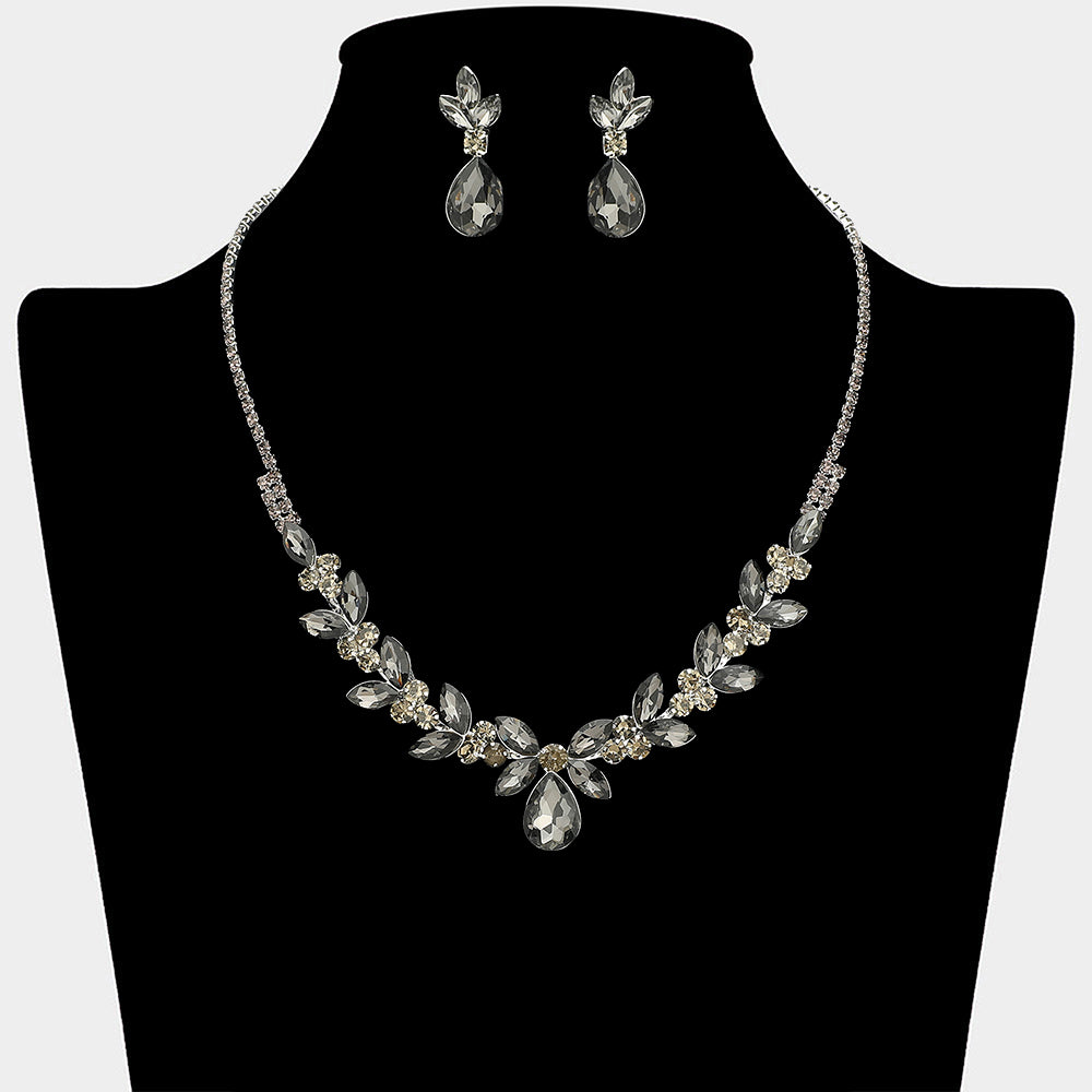 Smoky grey teardrop marquise leaf prom necklace set on silver with matching earrings displayed on a black mannequin bust on a white background.