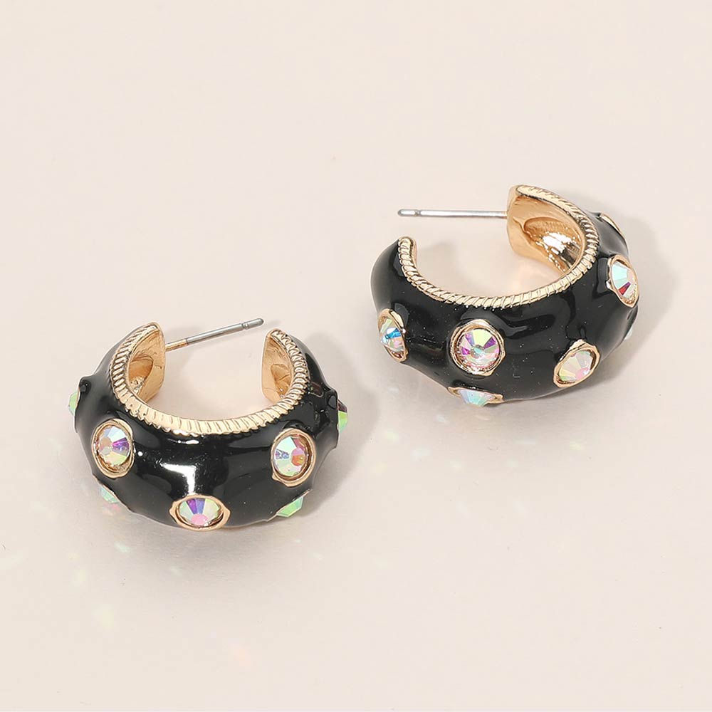 Black enamel huggie hoop earrings with AB stones 1 inch size shown on a beige background