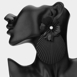 Oversized black flower fan statement earrings with layered floral tops and large pleated fan drops, displayed on a black jewelry mannequin.