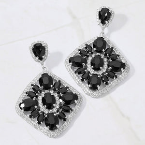 Black oval marquise stone cluster rhinestone statement earrings for pageant, gala, or evening wear on a white background