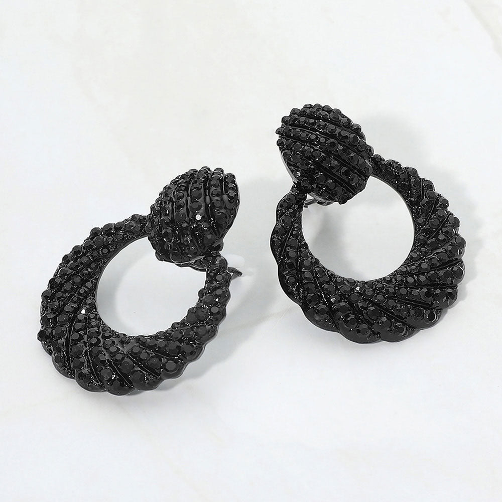 Black rhinestone pavé door knocker clip-on earrings on a white background