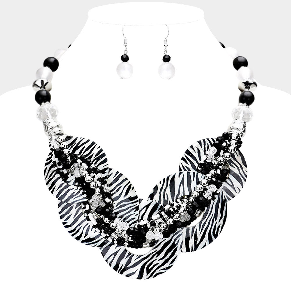 Black & White Animal Print Chunky Round Link Statement Necklace Set with matching earrings on a white bust