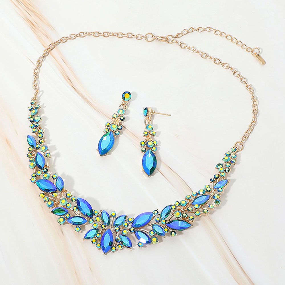 Blue AB marquise stone cluster prom and evening necklace set on gold on white marble background