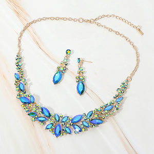 Blue AB marquise stone cluster prom and evening necklace set on gold on white marble background