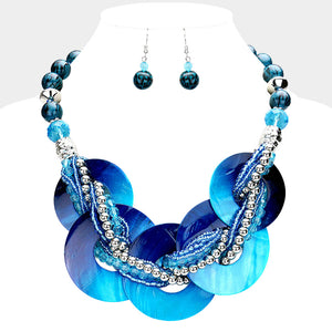 Blue chunky round link statement necklace set with matching earrings on white bust