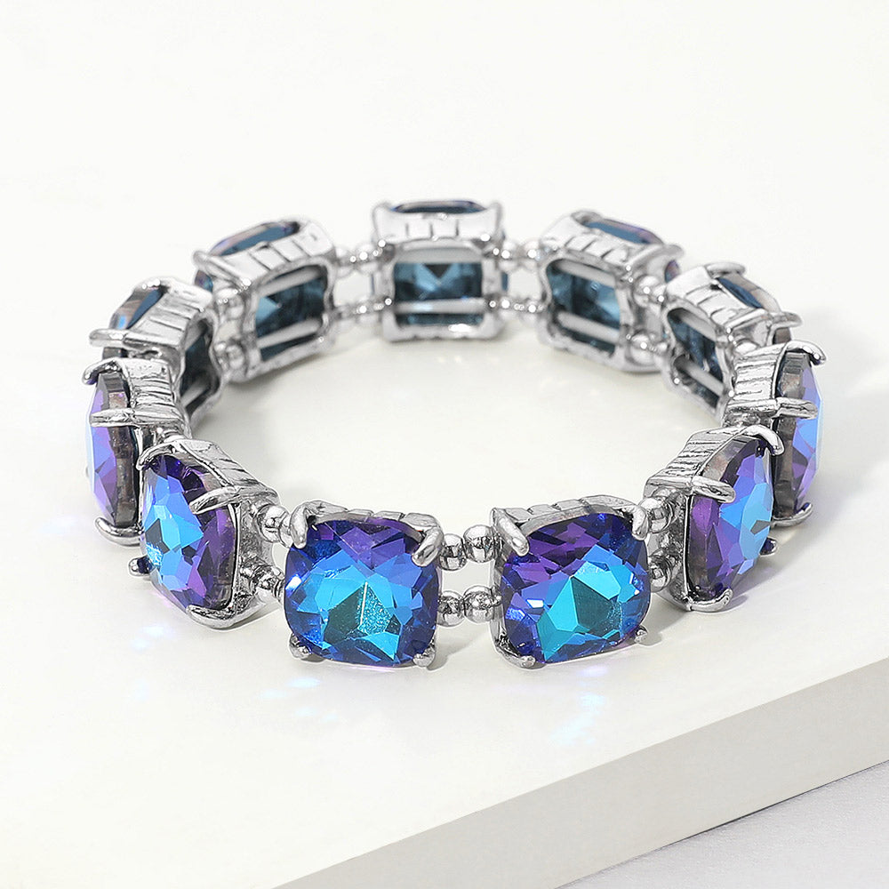 Blue cushion square stone stretch evening bracelet on silver, bold statement bracelet for evening wear on a white background