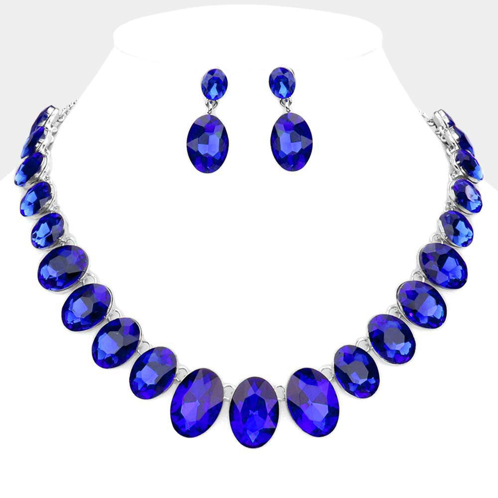 Jewelry set with blue necklace and earrings on a white background