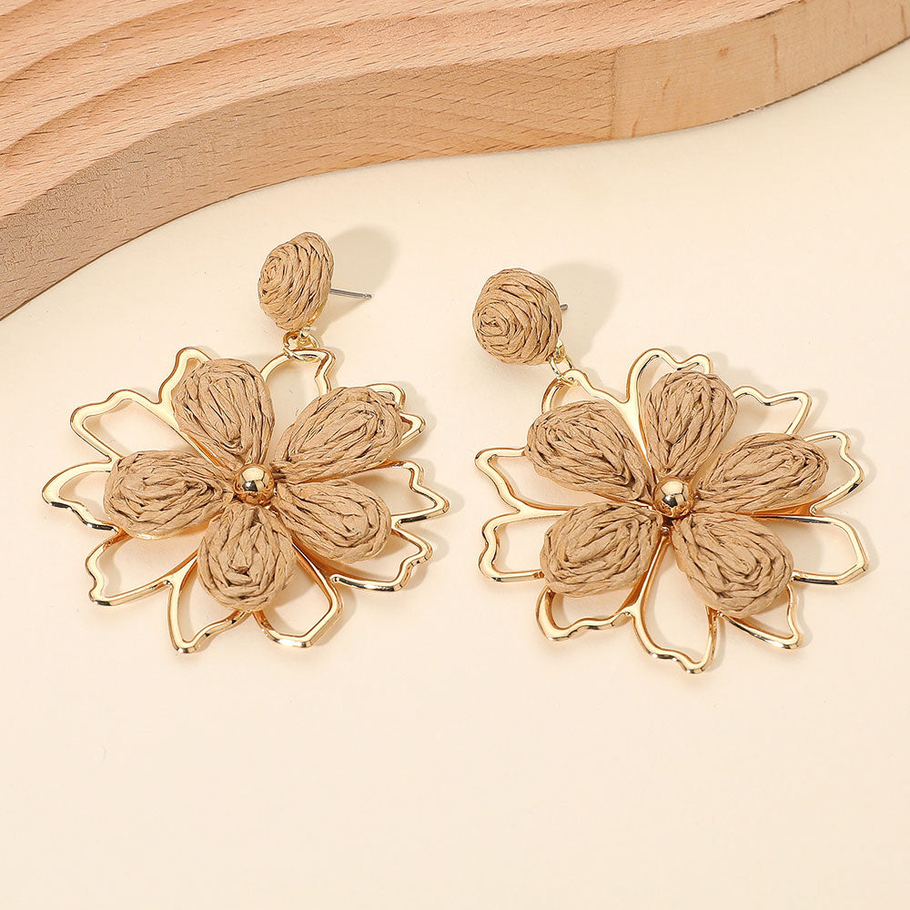 Taupe raffia floral petal dangle earrings with boho statement style for runway, pageant outfit of choice, or everyday fashion with wooden background