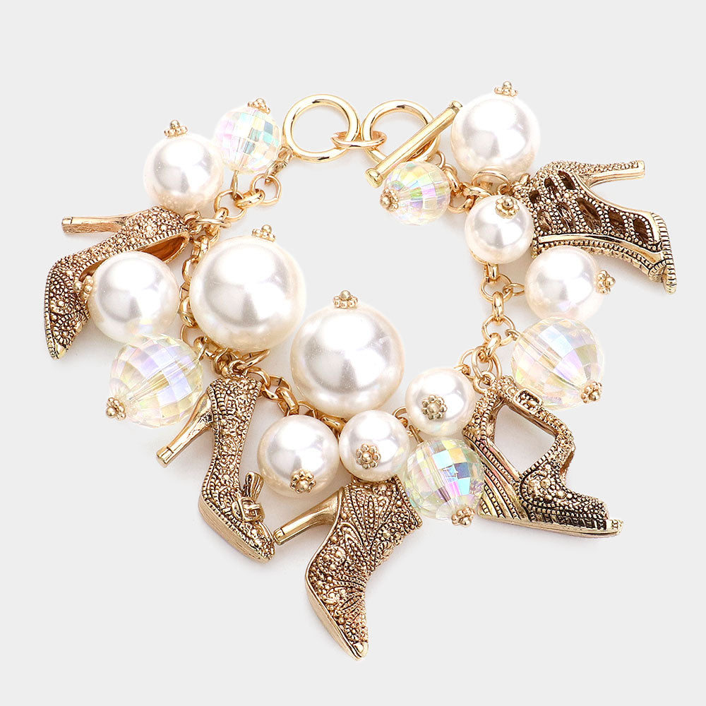 Gold Stiletto and Cream Pearl Charm Bracelet on a white background-perfect gifts for retiring queens, legends, directors, or anyone ready to sparkle