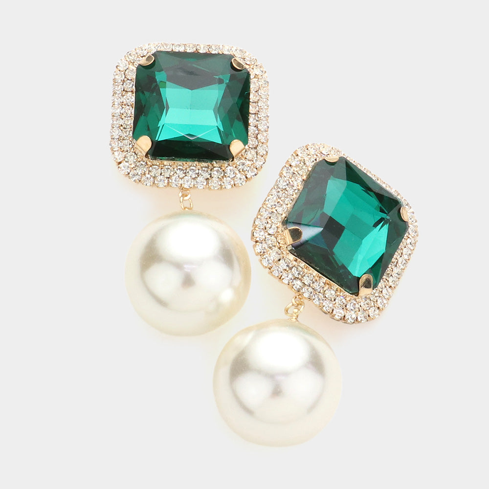 Emerald green square stone cream pearl link dangle clip-on earrings with gold-tone setting on a light gray background