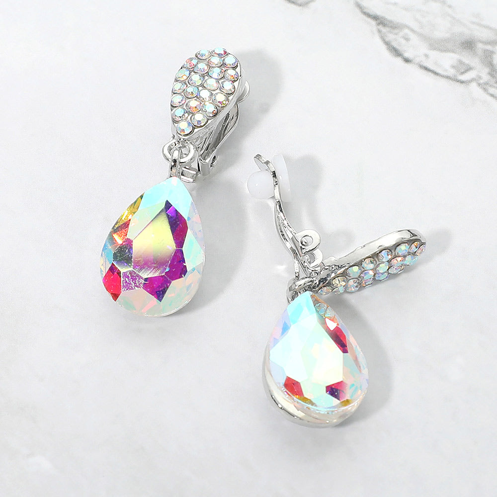 AB teardrop crystal drop clip-on earrings on silver with iridescent stones on white marble background