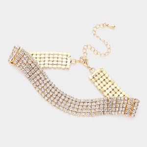 A gold-tone choker-style bracelet with multiple rows of clear rhinestones, featuring a curved main band, rectangular front and back plates, and an adjustable chain clasp, shown on a light gray background.