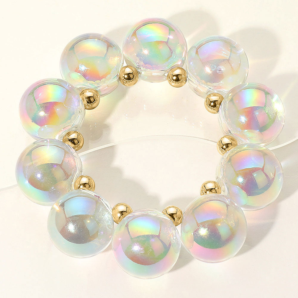 Chunky Clear and Gold iridescent balls/spheres bracelet on a white background
