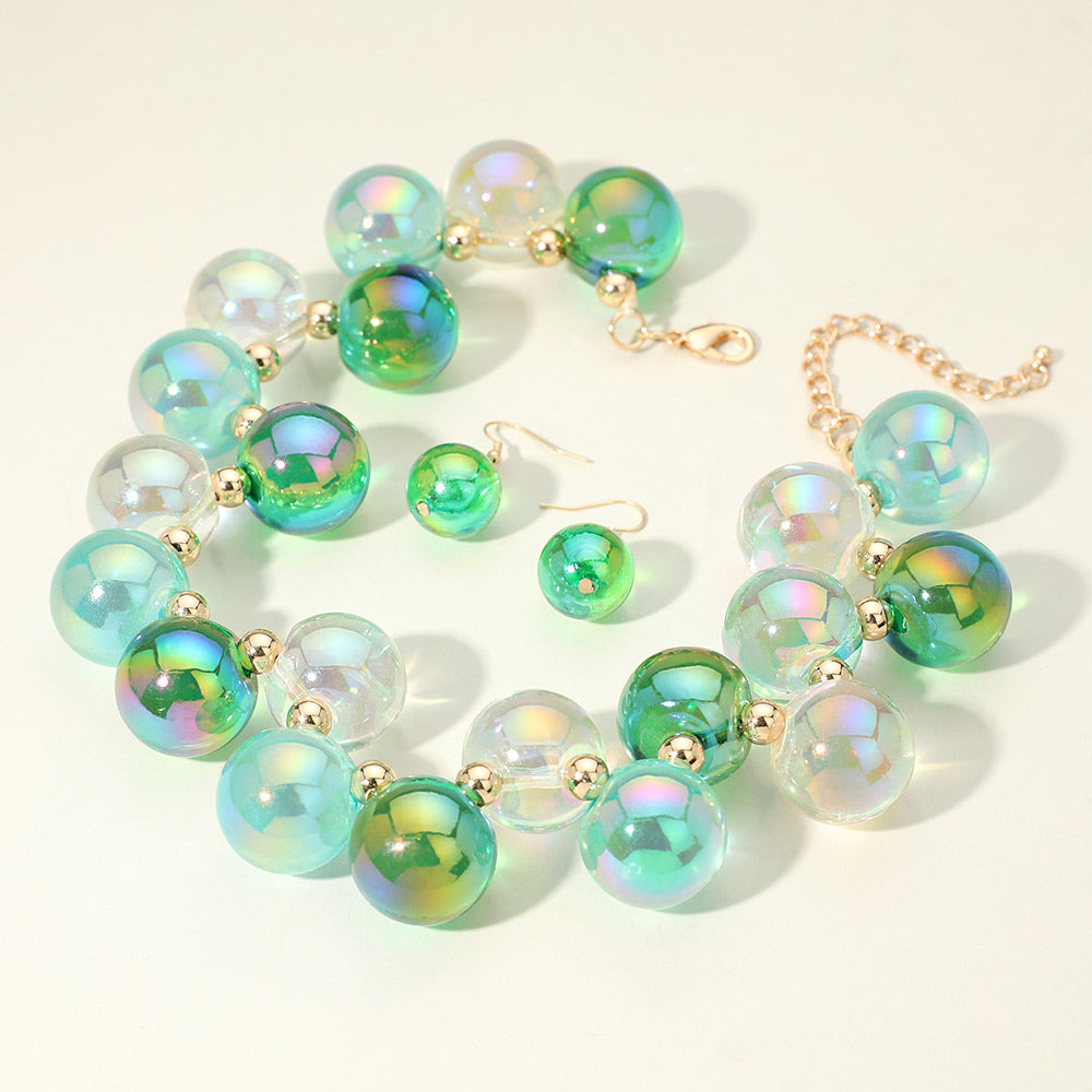 Chunky green, mint & clear iridescent balls/spheres necklace with matching earrings on a white background