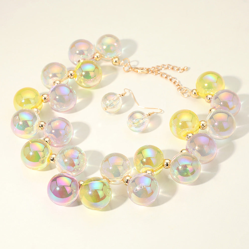 Chunky yellow & clear iridescent balls/spheres necklace with matching earrings on a white background