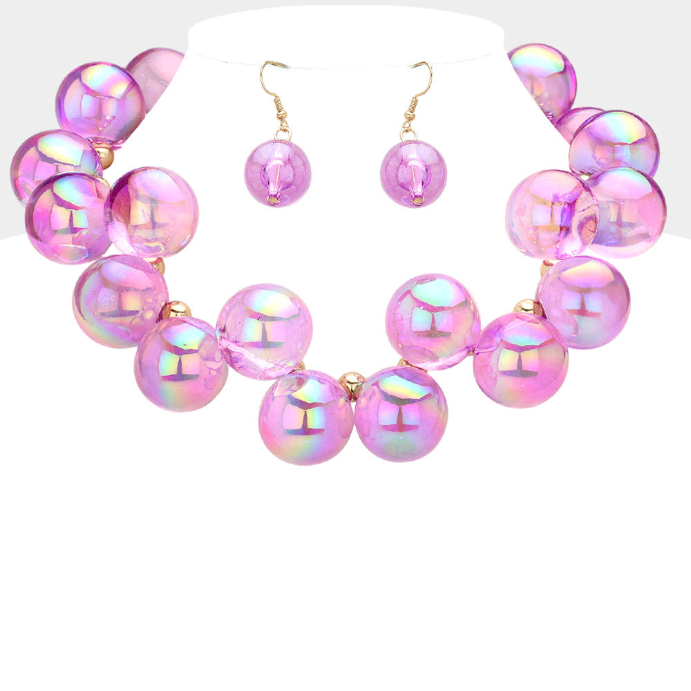Chunky purple iridescent balls/spheres necklace with matching earrings on a white background