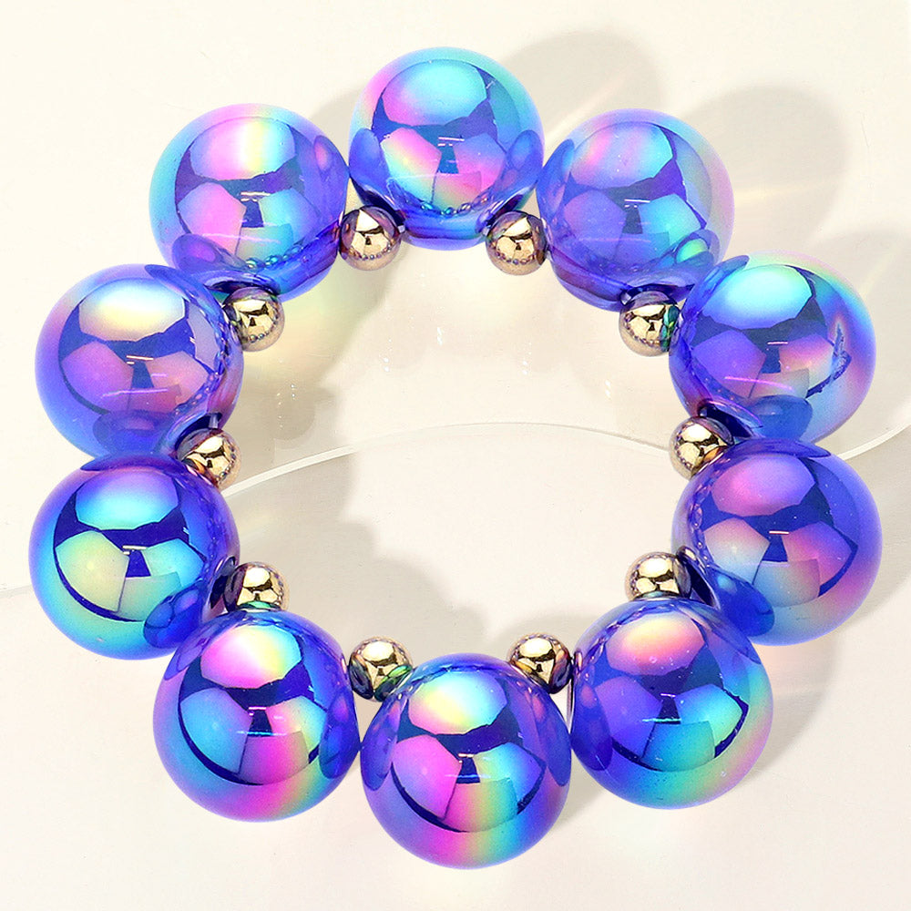 Chunky royal blue iridescent balls/spheres bracelet on a white background