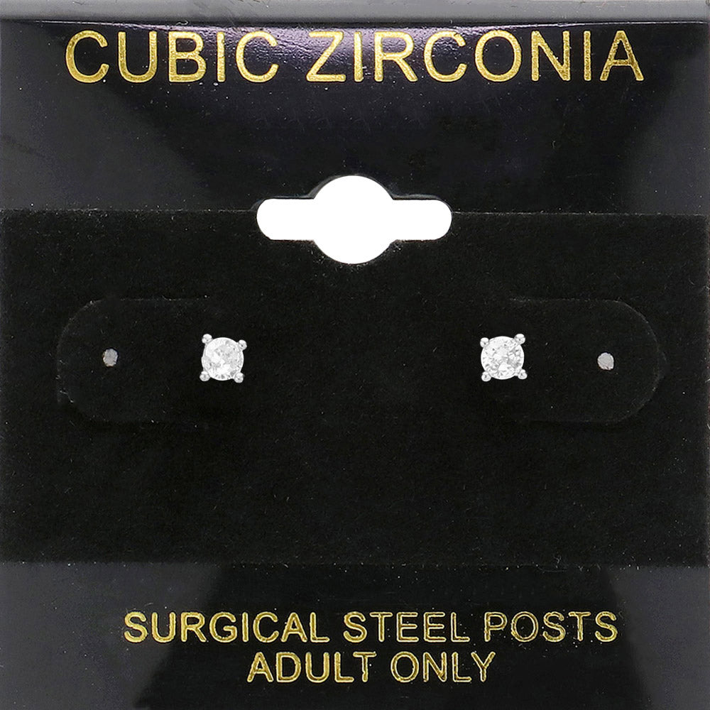 Classic round clear crystal stud earrings in a silver finish with prong settings and surgical steel posts, displayed on a black jewelry card.