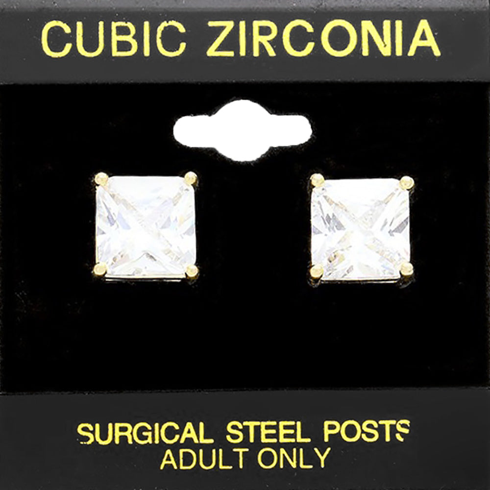 Classic square clear crystal stud earrings in a gold finish with four-prong settings and surgical steel posts, displayed on a black jewelry card.
