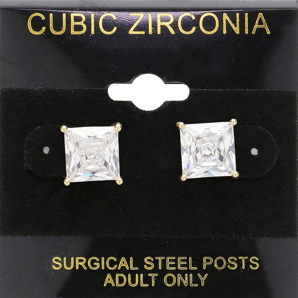 Classic square clear crystal stud earrings in a gold finish with four-prong settings and surgical steel posts, displayed on a black jewelry card.